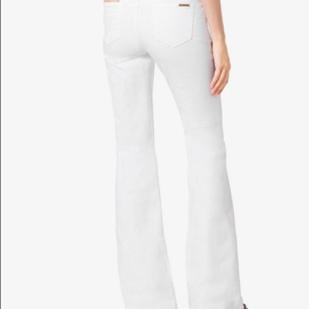 NWT Michael Kors white flared jeans.